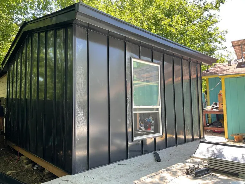 Black standing seam metal wall panels for Metal Roof Installation in Portage